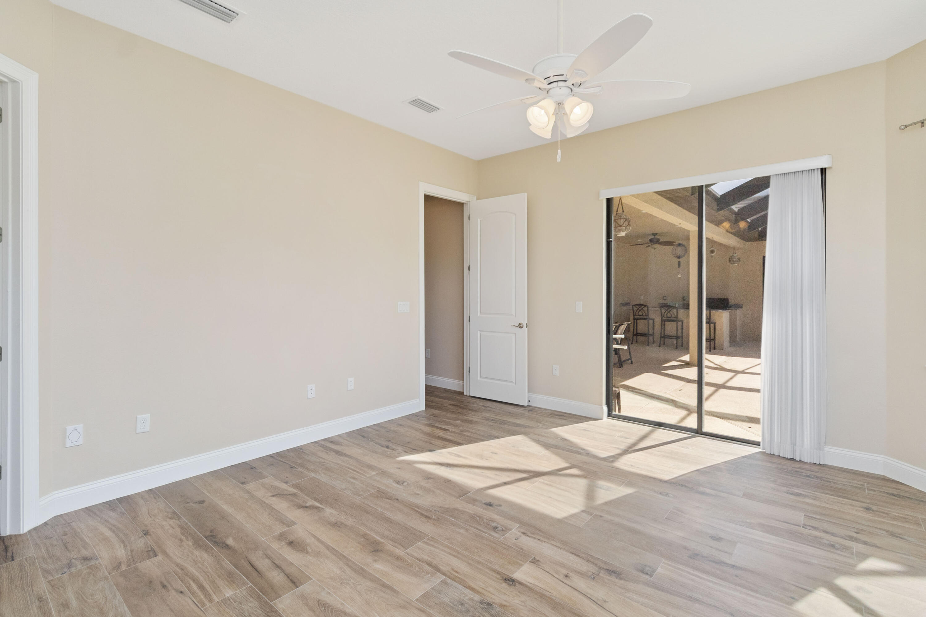 3640 Corey Road Grant Valkaria, FL 32950 - Photo 50 of 77 a view of an empty room with glass door
