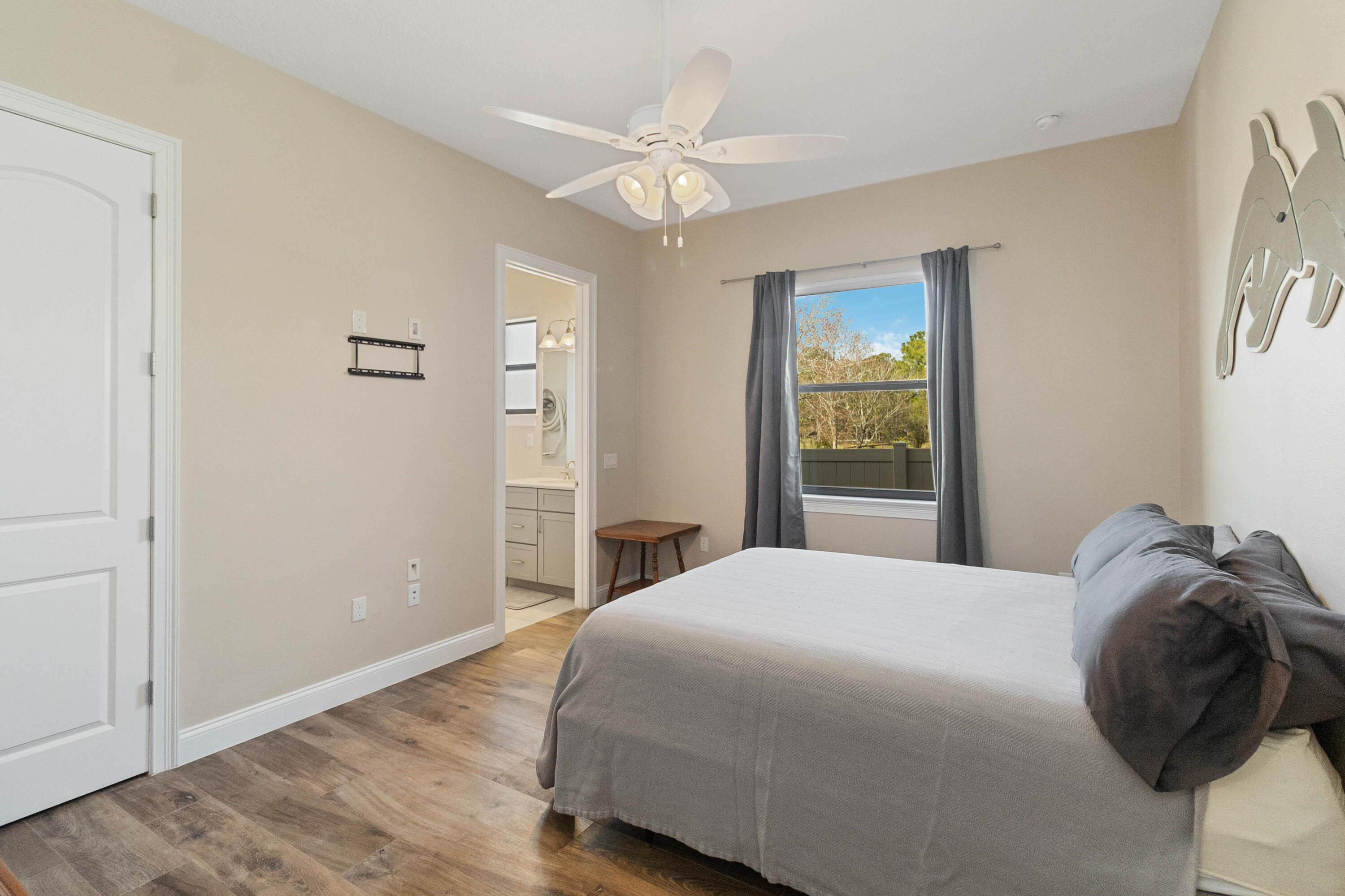 3640 Corey Road Grant Valkaria, FL 32950 - Photo 53 of 77 a bedroom with a bed and a window