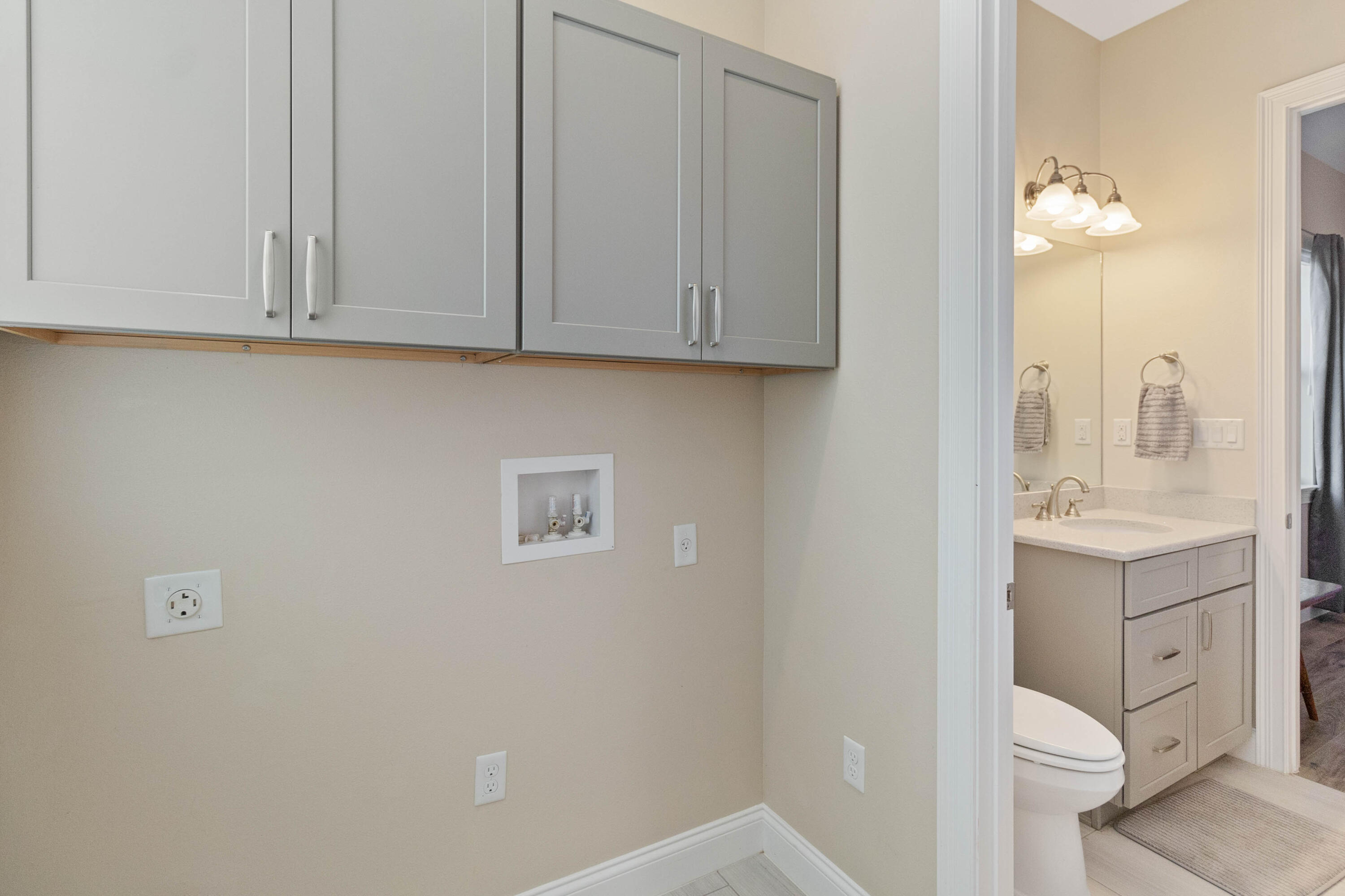 3640 Corey Road Grant Valkaria, FL 32950 - Photo 56 of 77 a bathroom with a sink and a mirror