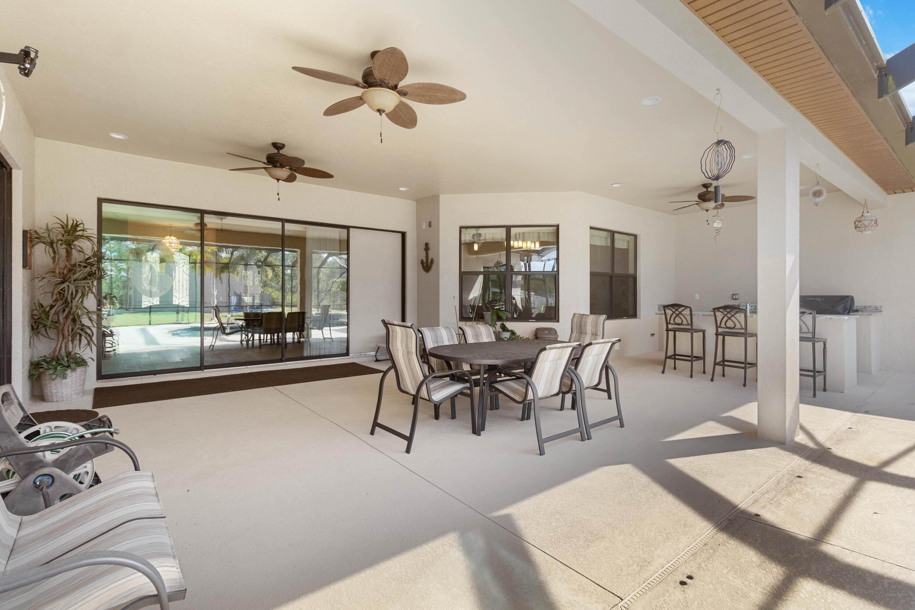 3640 Corey Road Grant Valkaria, FL 32950 - Photo 58 of 77 a living room with furniture and a large window