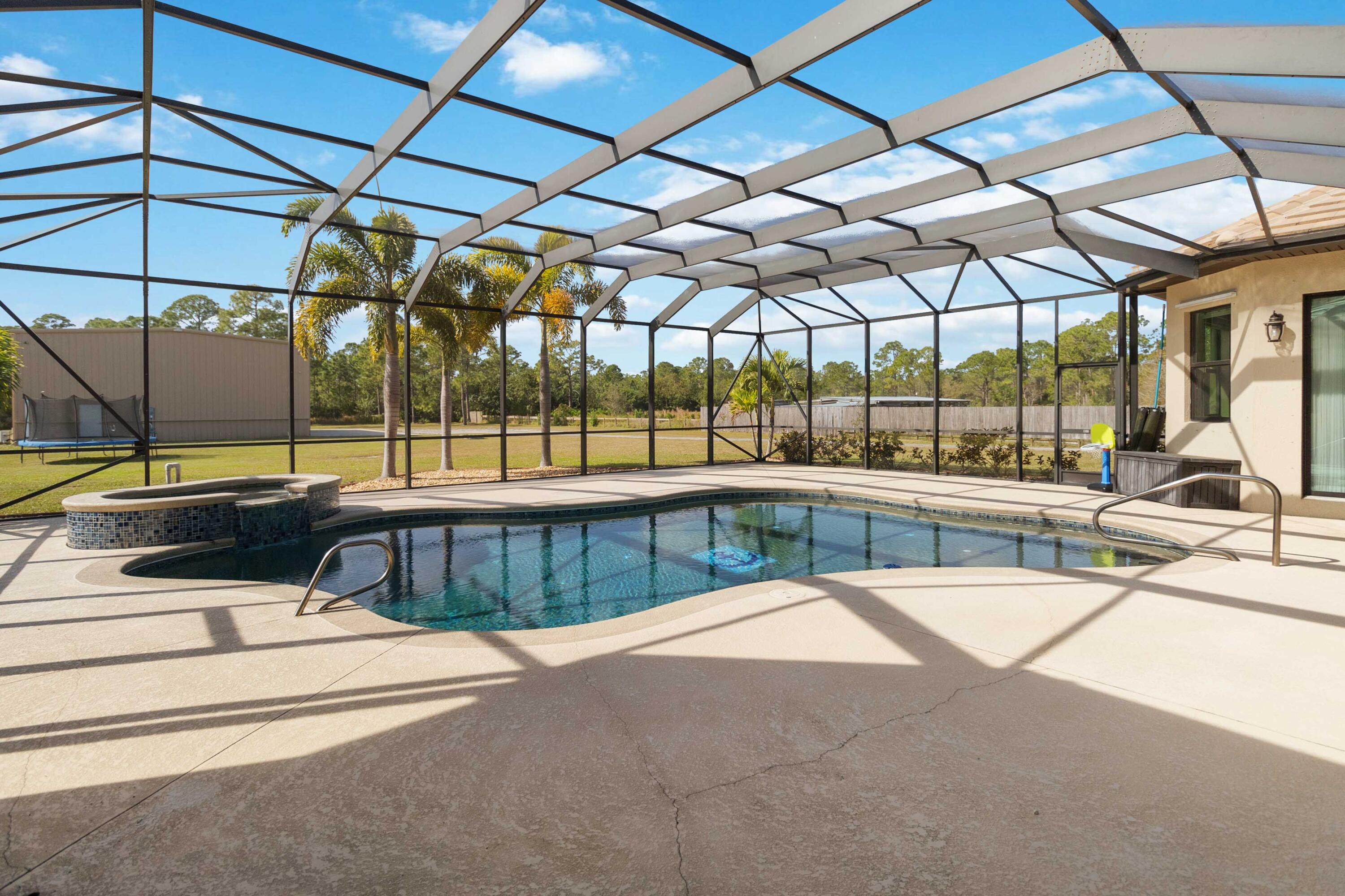 3640 Corey Road Grant Valkaria, FL 32950 - Photo 62 of 77 a view of swimming pool with a patio