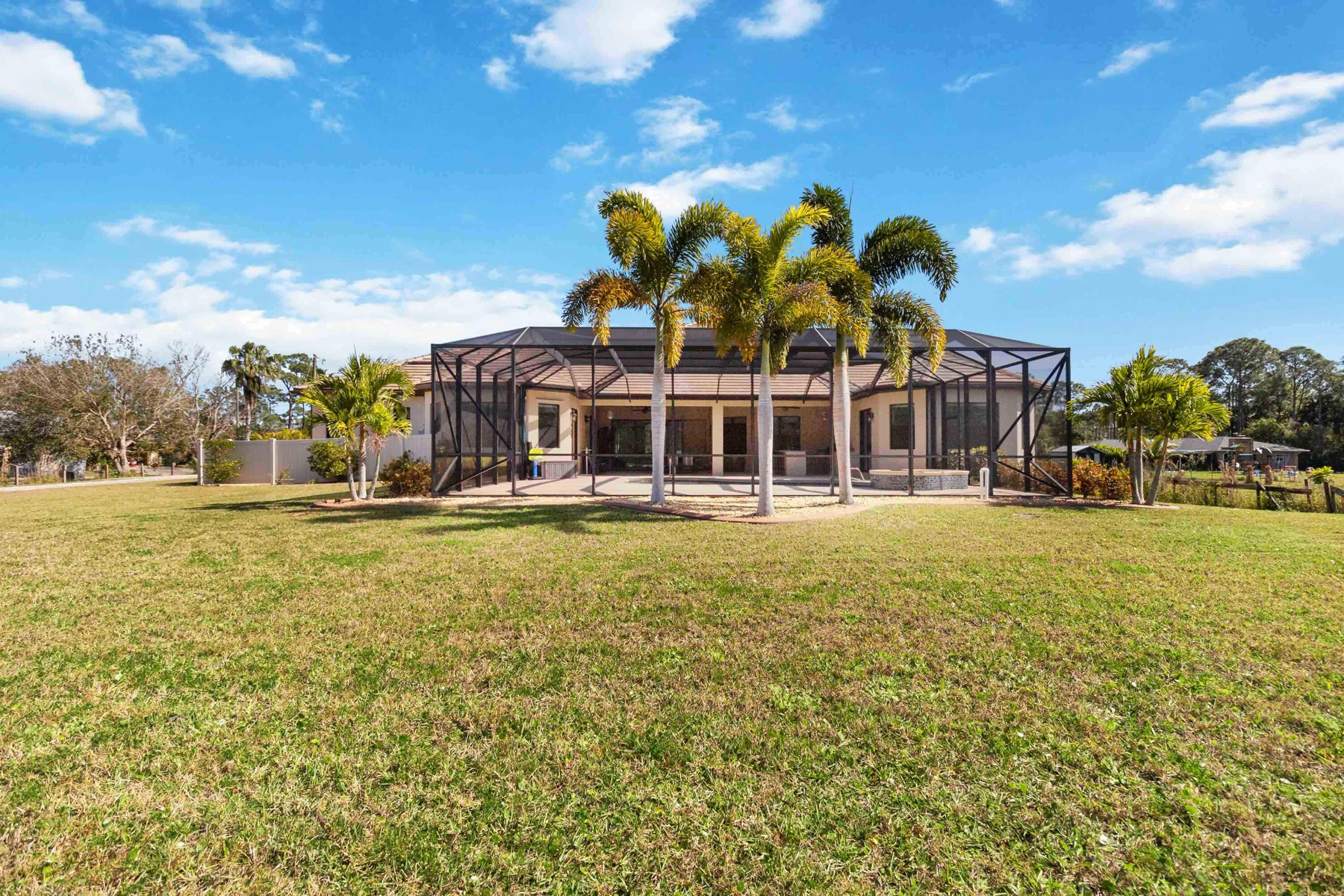3640 Corey Road Grant Valkaria, FL 32950 - Photo 66 of 77 a front view of a house with a garden