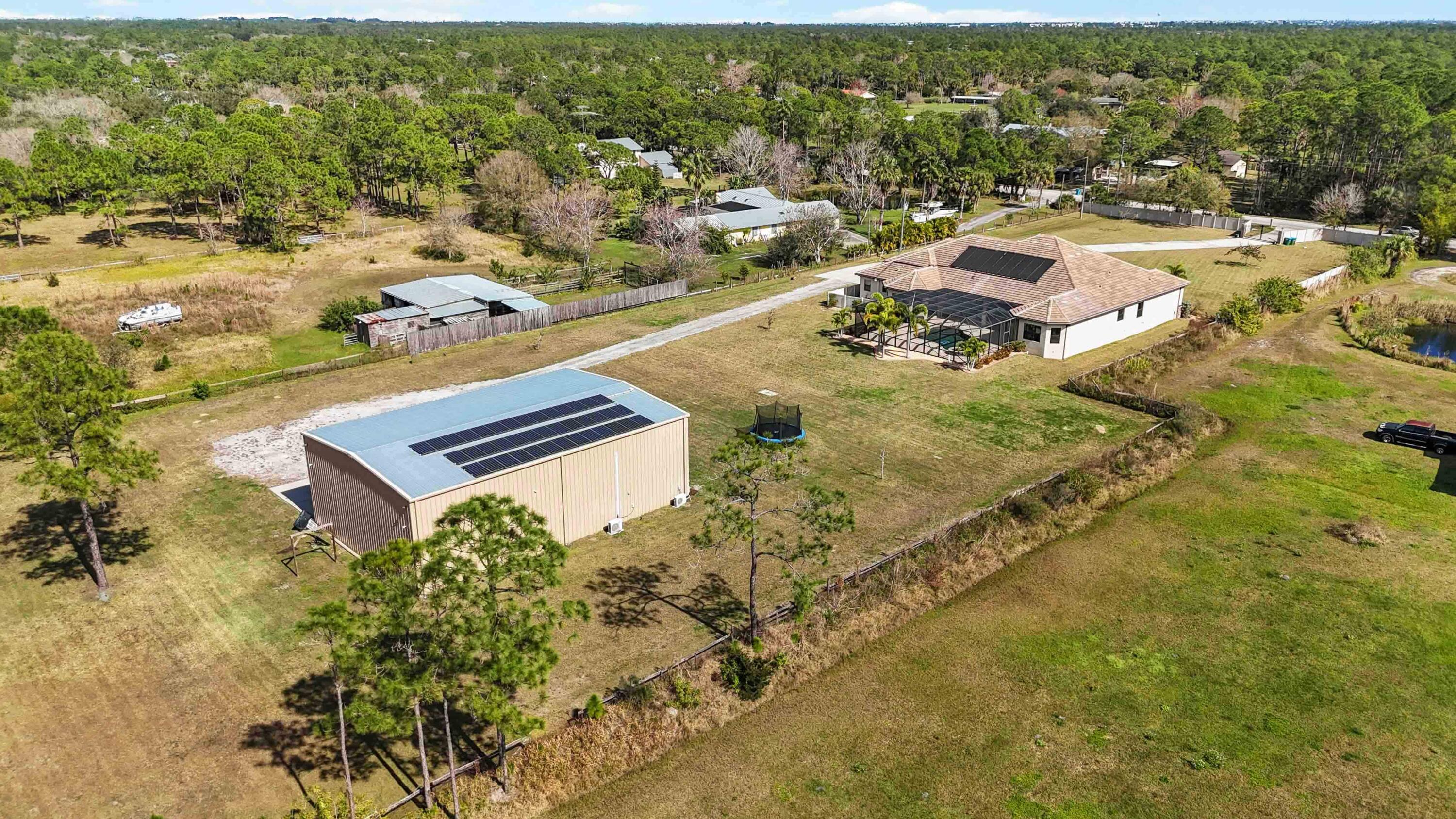 3640 Corey Road Grant Valkaria, FL 32950 - Photo 8 of 77 an aerial view of residential houses with outdoor space