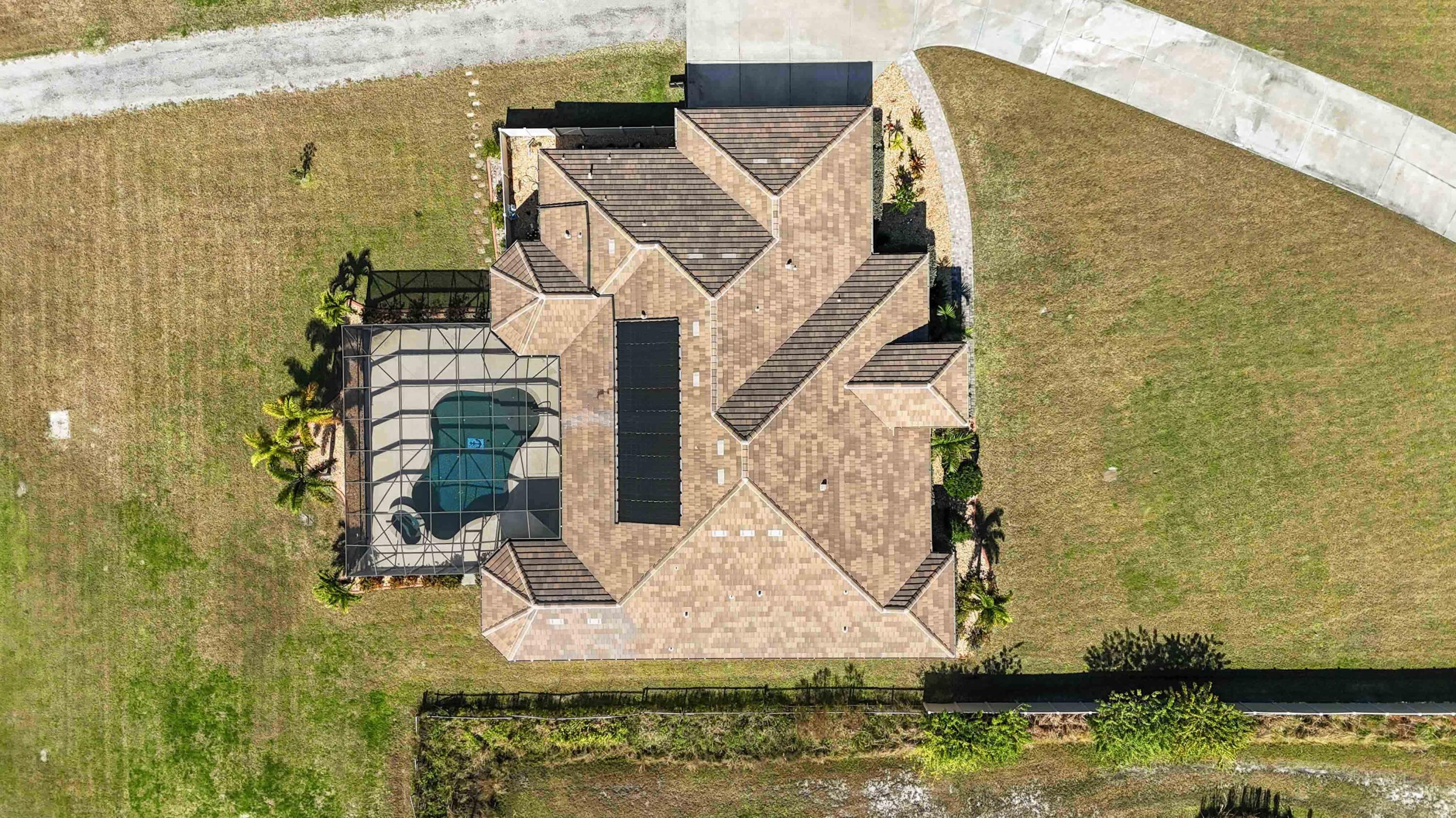 3640 Corey Road Grant Valkaria, FL 32950 - Photo 9 of 77 a view of a house with a swimming pool