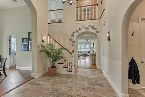 a view of a livingroom with furniture and stairs