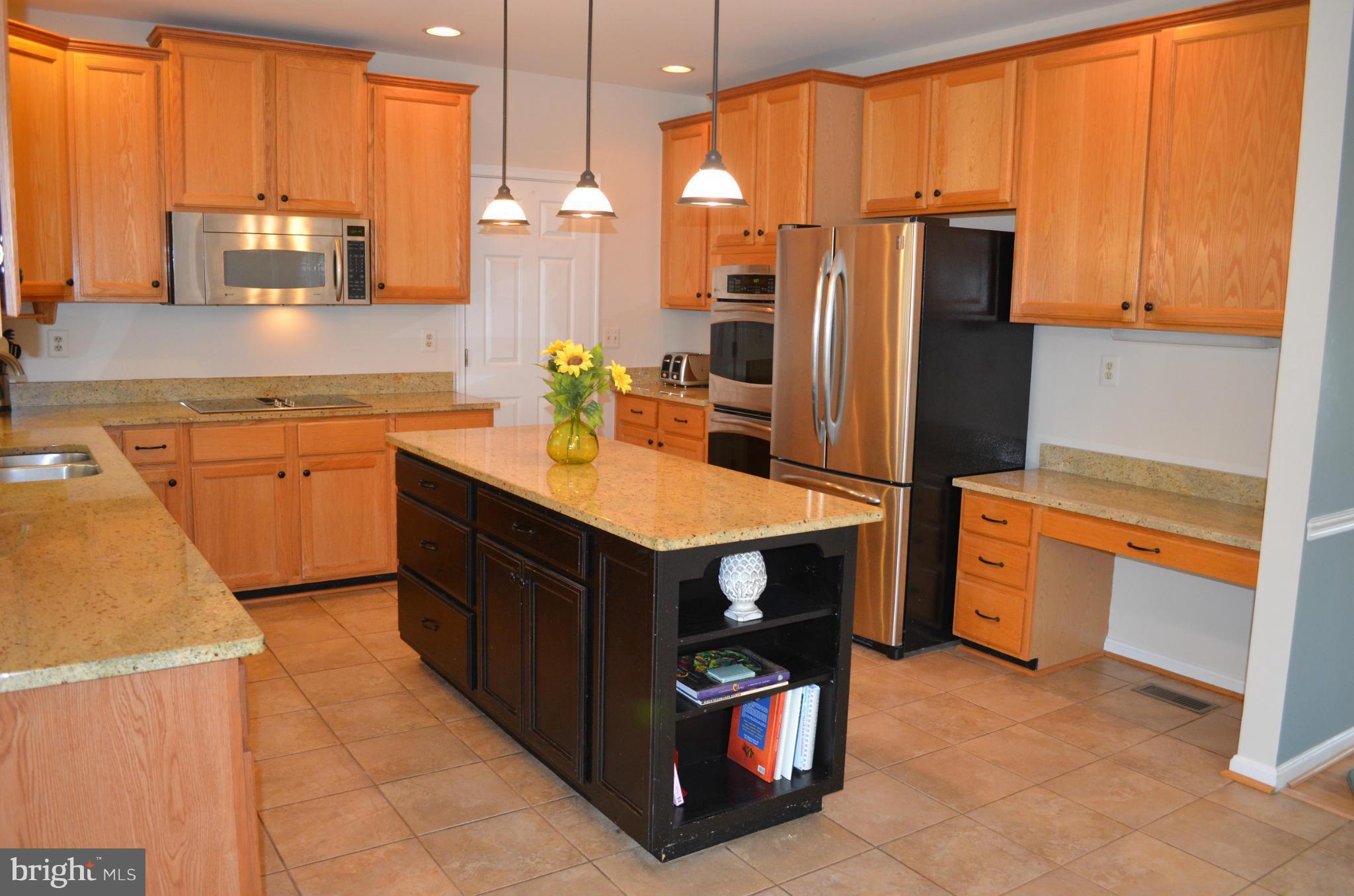 6318 Spring Forest Road Frederick, MD 21701 - Photo 11 of 30 Kitchen with stainless appliances, desk center