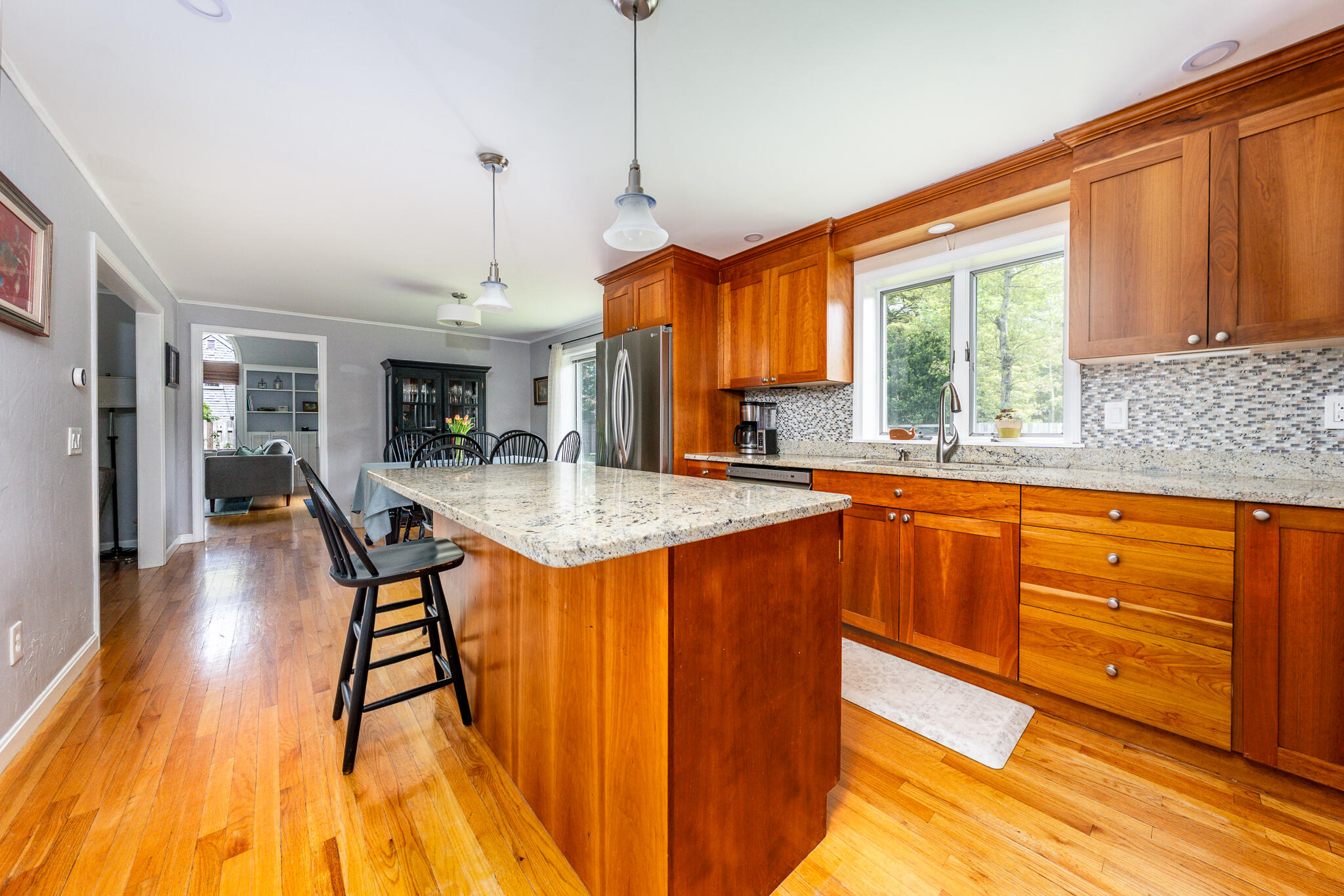 61 Angus Way Centerville, MA 02632 - Photo 15 of 59 a kitchen with stainless steel appliances granite countertop sink stove top oven and cabinets