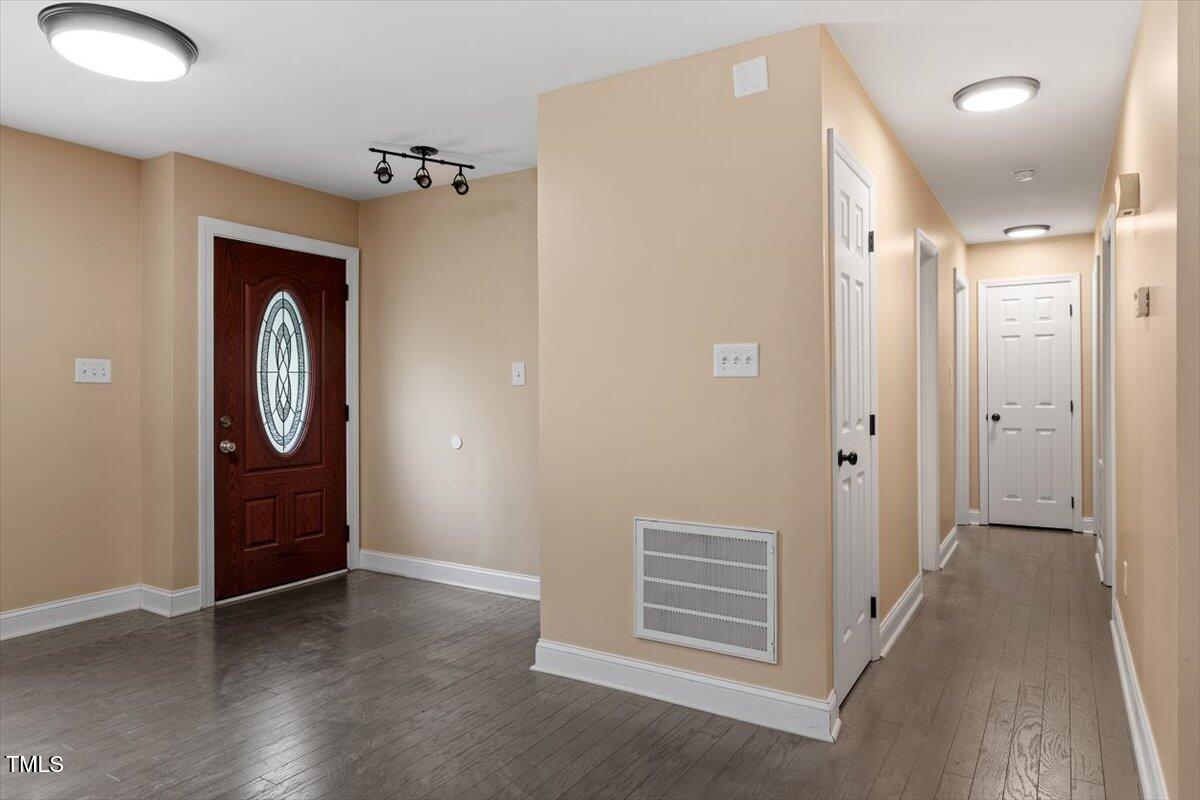 3605 Satellite Court Raleigh, NC 27604 - Photo 16 of 37 a view of a hallway with wooden floor