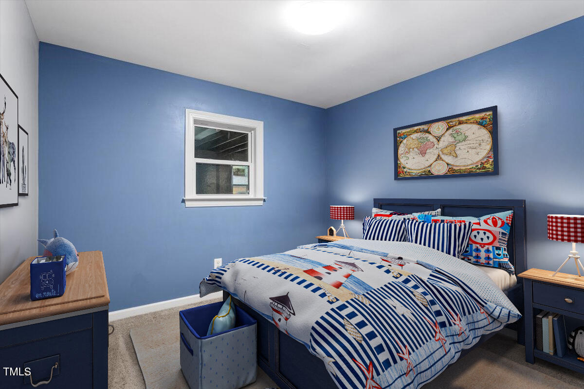 3605 Satellite Court Raleigh, NC 27604 - Photo 18 of 37 a bedroom with a bed and a window