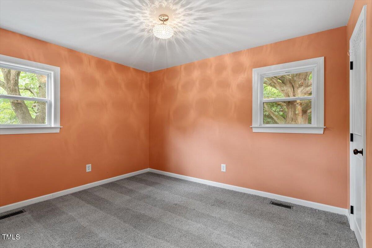 3605 Satellite Court Raleigh, NC 27604 - Photo 20 of 37 an empty room with windows and fan
