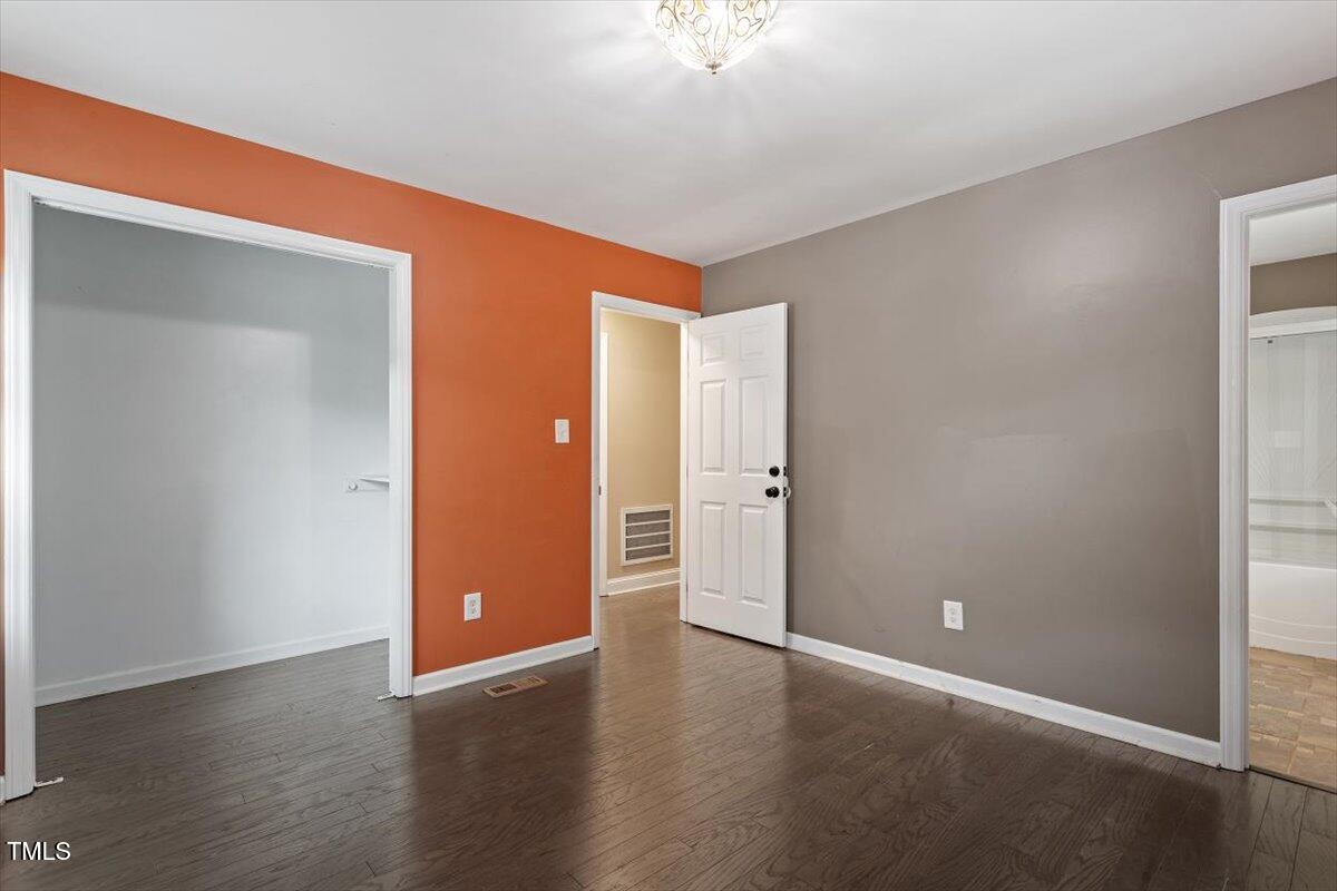 3605 Satellite Court Raleigh, NC 27604 - Photo 24 of 37 a view of an empty room with wooden floor