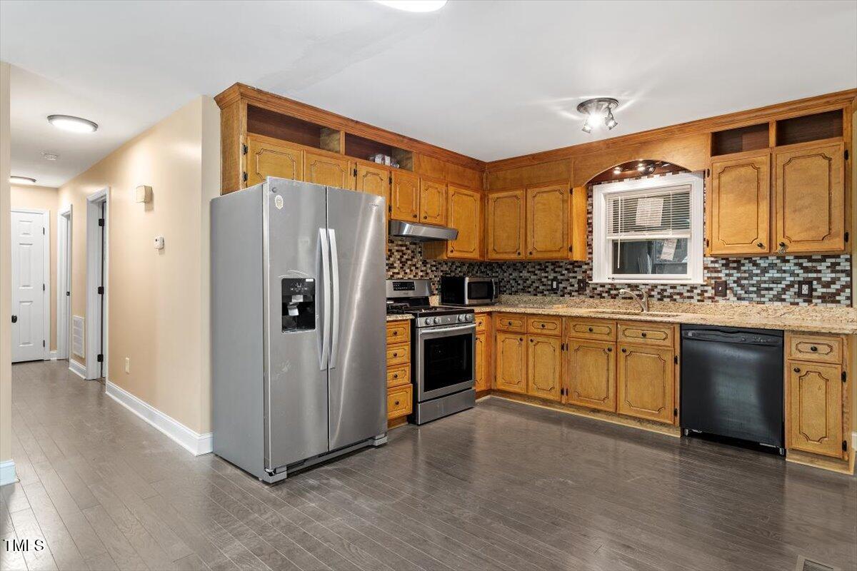 3605 Satellite Court Raleigh, NC 27604 - Photo 9 of 37 a kitchen with stainless steel appliances a refrigerator and a stove top oven