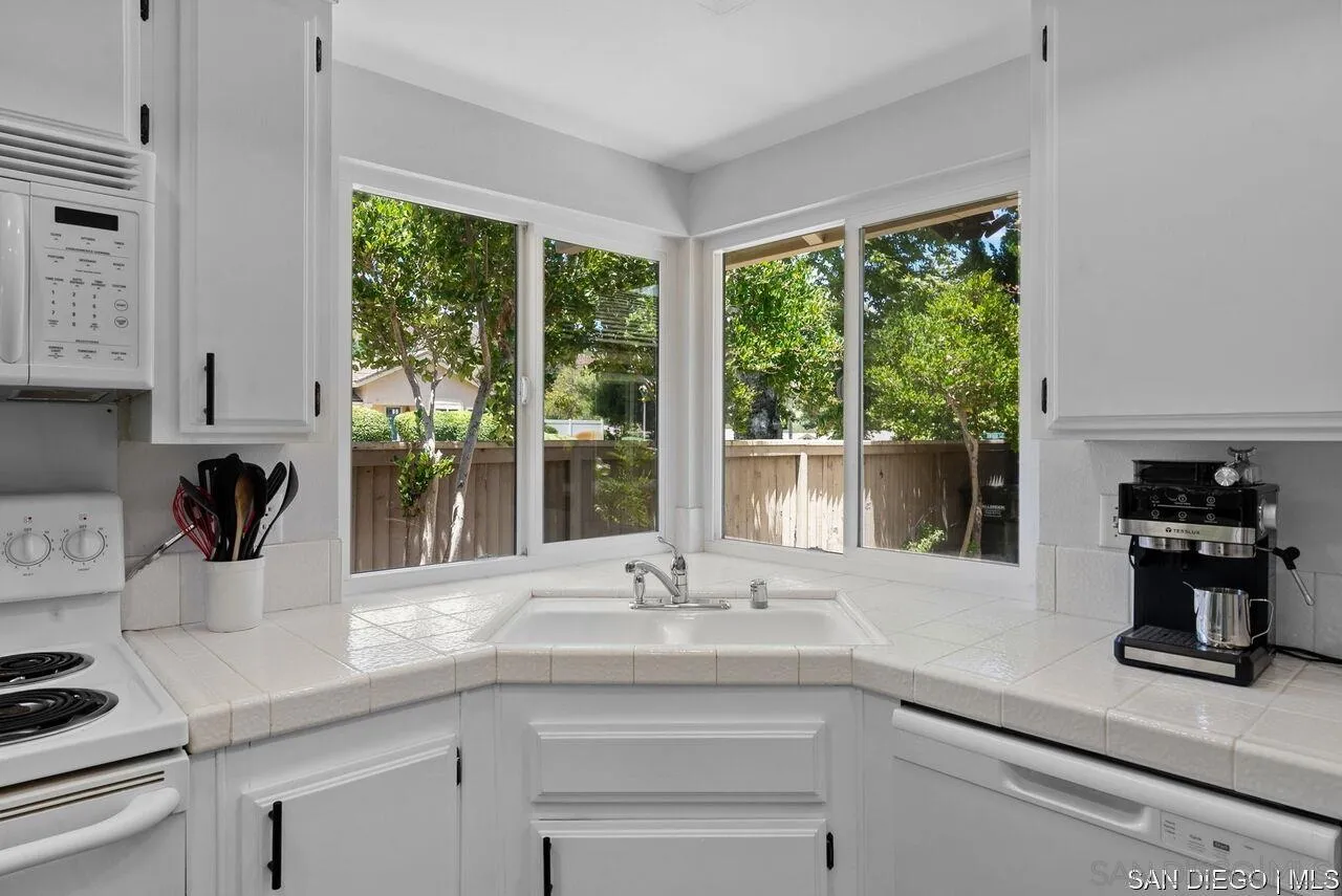 4309 Diegos Court Fallbrook, CA 92028 - Photo 12 of 33 a kitchen with a sink and large window