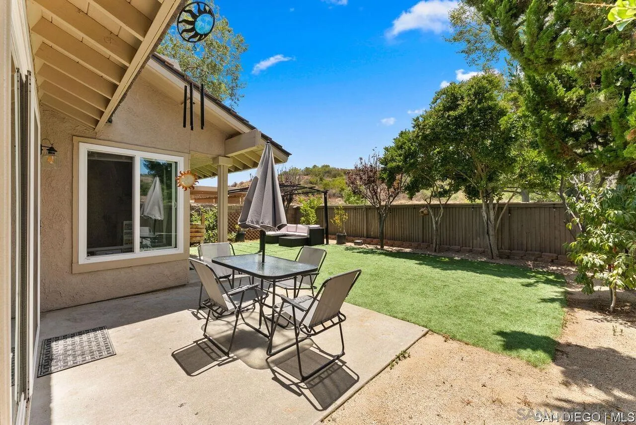 4309 Diegos Court Fallbrook, CA 92028 - Photo 17 of 33 a patio with table and chairs and potted plants