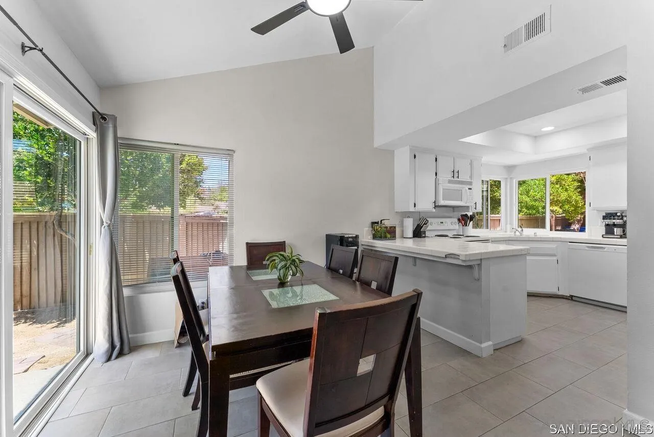 4309 Diegos Court Fallbrook, CA 92028 - Photo 2 of 33 a view of a dining room with furniture and window