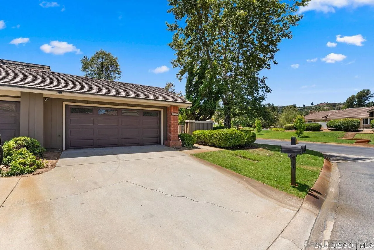 4309 Diegos Court Fallbrook, CA 92028 - Photo 23 of 33 a front view of a house with a yard and garage