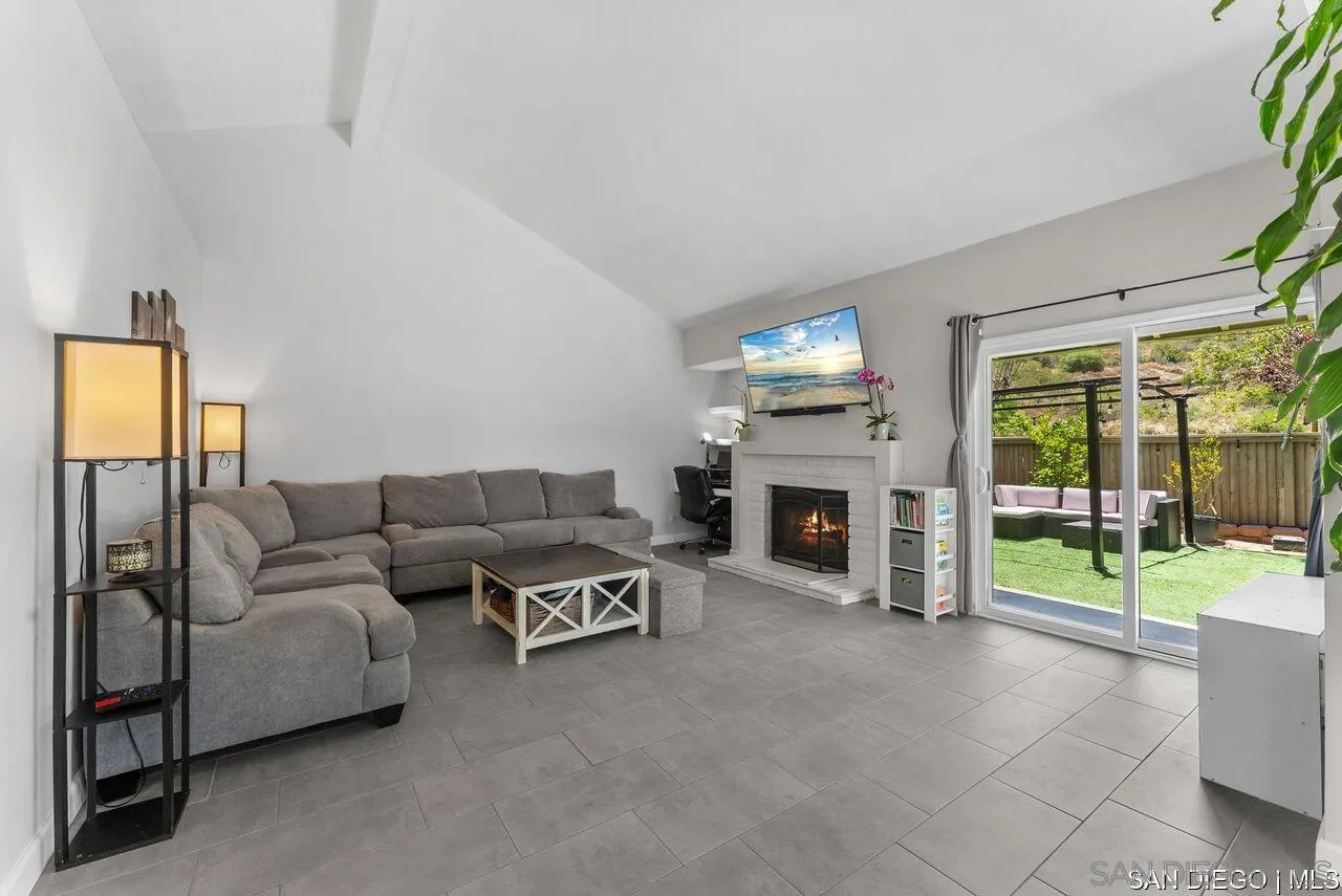 4309 Diegos Court Fallbrook, CA 92028 - Photo 4 of 33 a living room with furniture and a fireplace