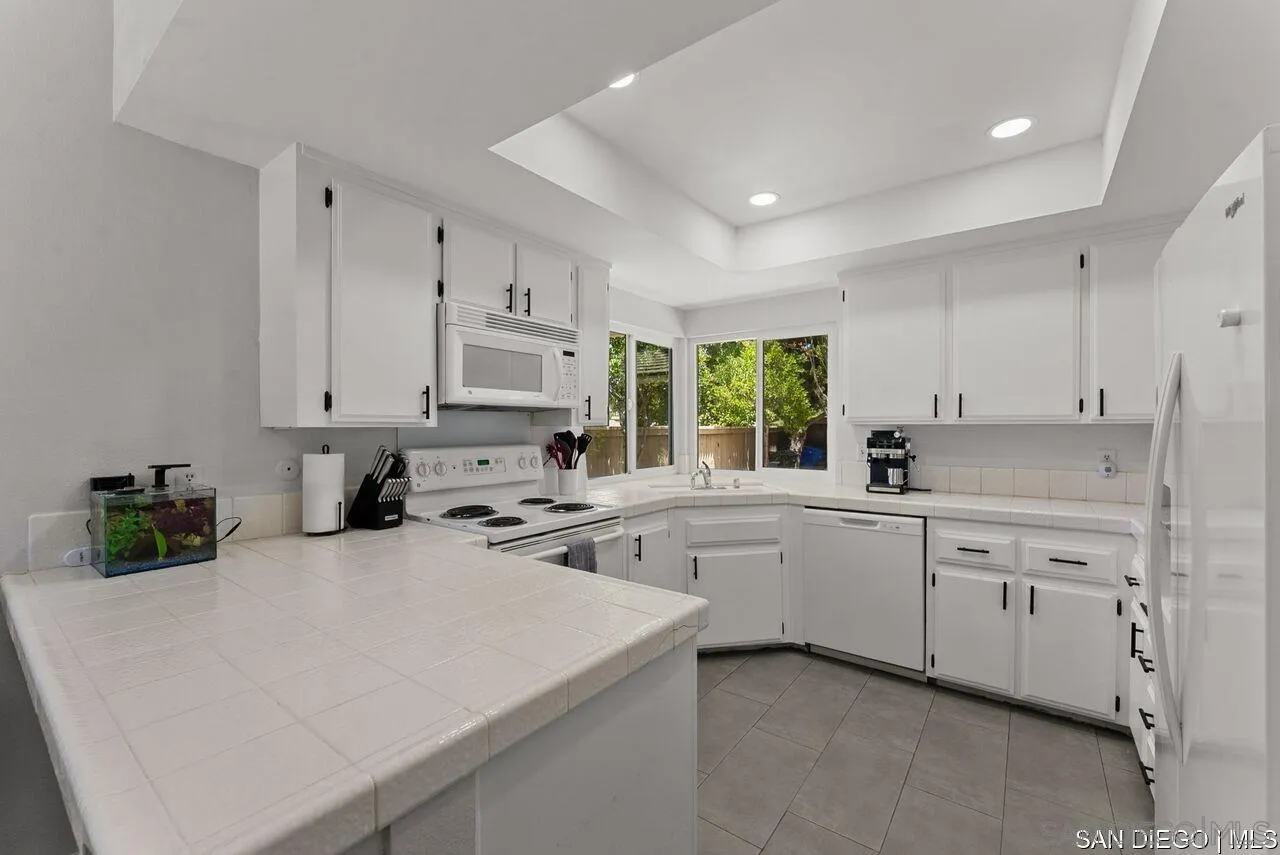4309 Diegos Court Fallbrook, CA 92028 - Photo 10 of 33 a kitchen that has a sink and a stove in it