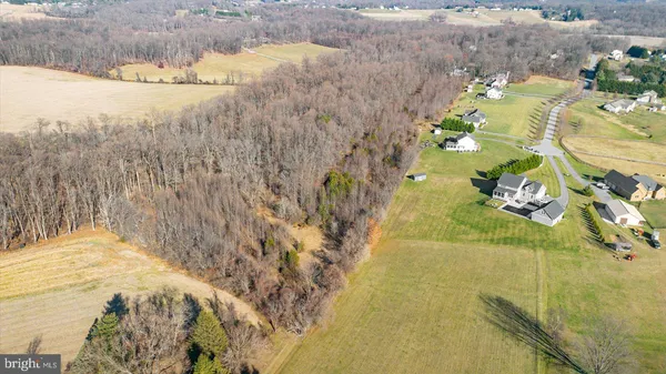 a view of a swimming pool with a yard and mountain view