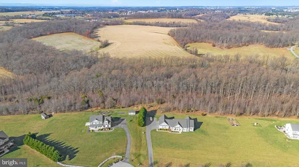 a view of a swimming pool with a yard