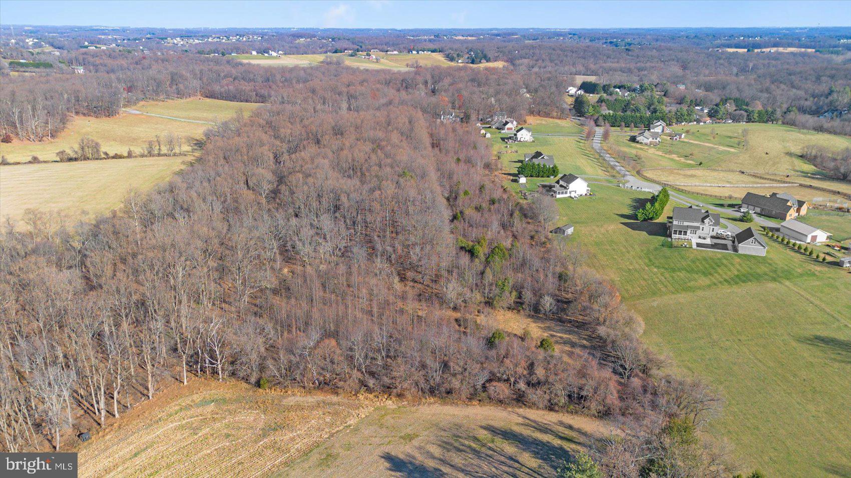 18.25 Sykesville Road Westminster, MD 21157 - Photo 7 of 14 an aerial view of residential houses with outdoor space and trees