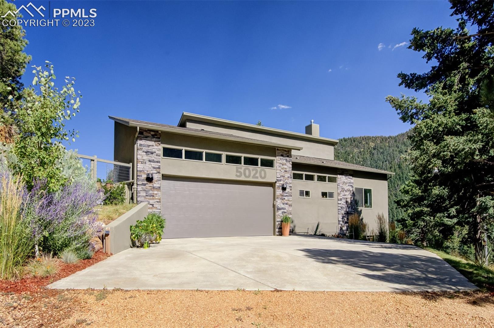 5020 South High Ridge View Manitou Springs, CO 80829 - Photo 1 of 46 Front of this beautiful custom home located in Crystal Park!