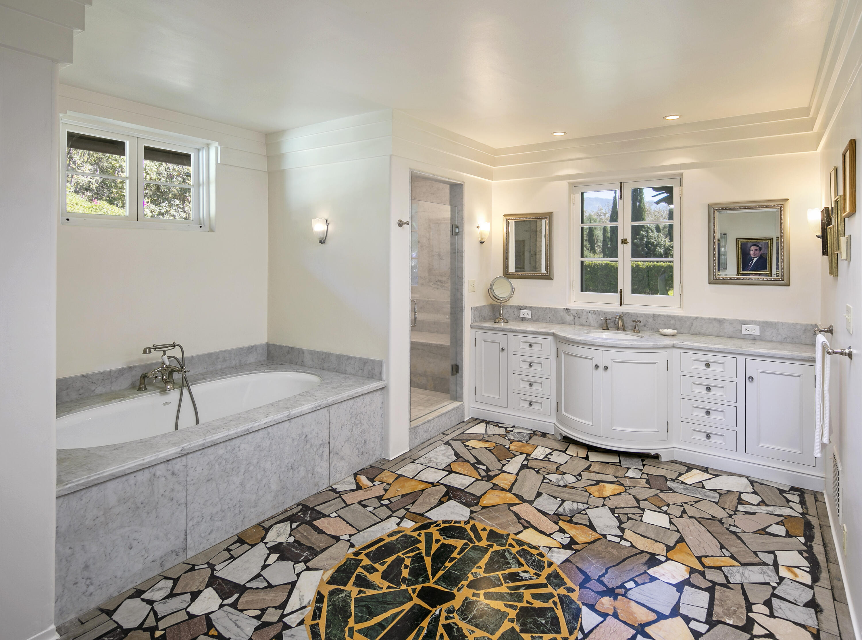 2925 Sycamore Canyon Road Montecito, CA 93108 - Photo 12 of 19 a spacious bathroom with a granite countertop sink a mirror and a bathtub