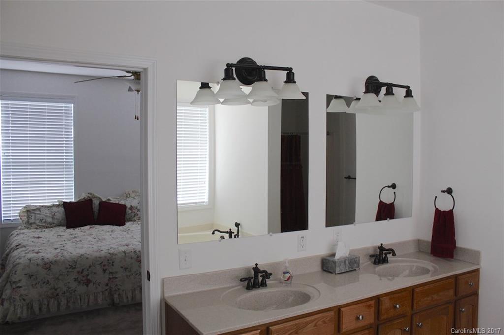 136 Scherer Drive Rutherfordton, NC 28139 - Photo 14 of 24 a bathroom with double vanity and a mirror