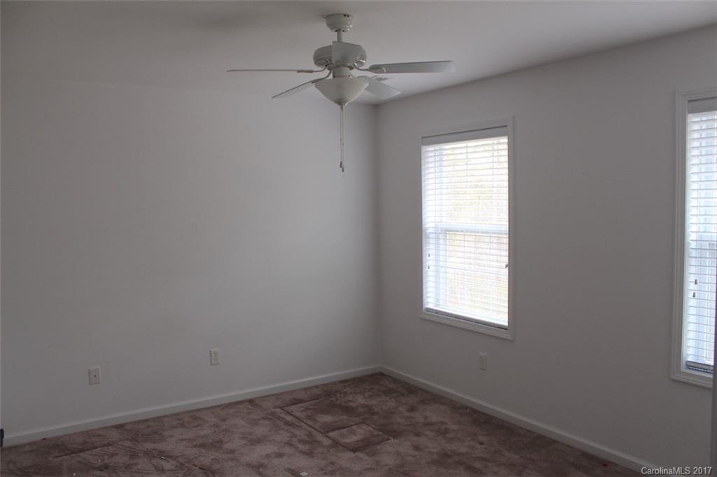 136 Scherer Drive Rutherfordton, NC 28139 - Photo 15 of 24 an empty room with a window and a fan