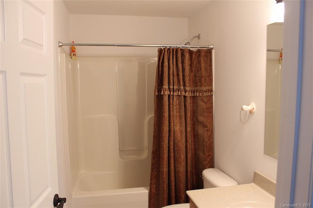 136 Scherer Drive Rutherfordton, NC 28139 - Photo 18 of 24 a bathroom with a shower and a toilet