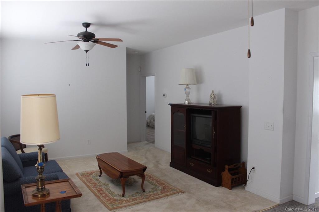136 Scherer Drive Rutherfordton, NC 28139 - Photo 7 of 24 a living room with furniture and a lamp