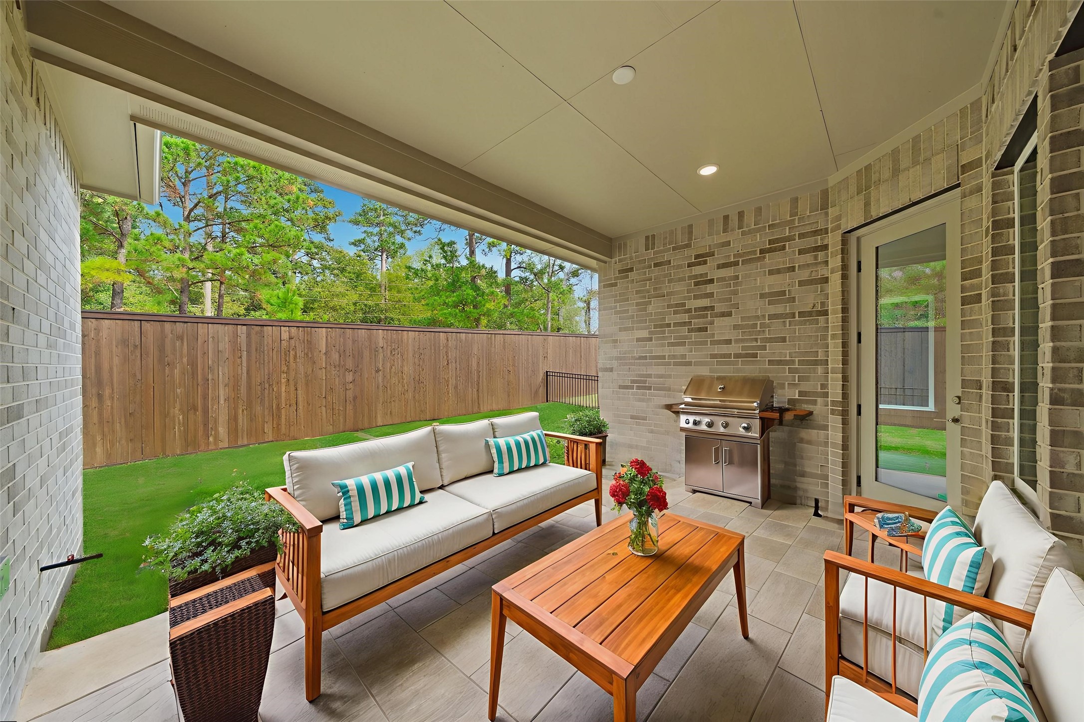 10026 Larkin Cove Willis, TX 77318 - Photo 31 of 44 Private backyard retreat with no rear neighbors and an 8-ft wooden privacy fence—perfect for relaxing or entertaining.