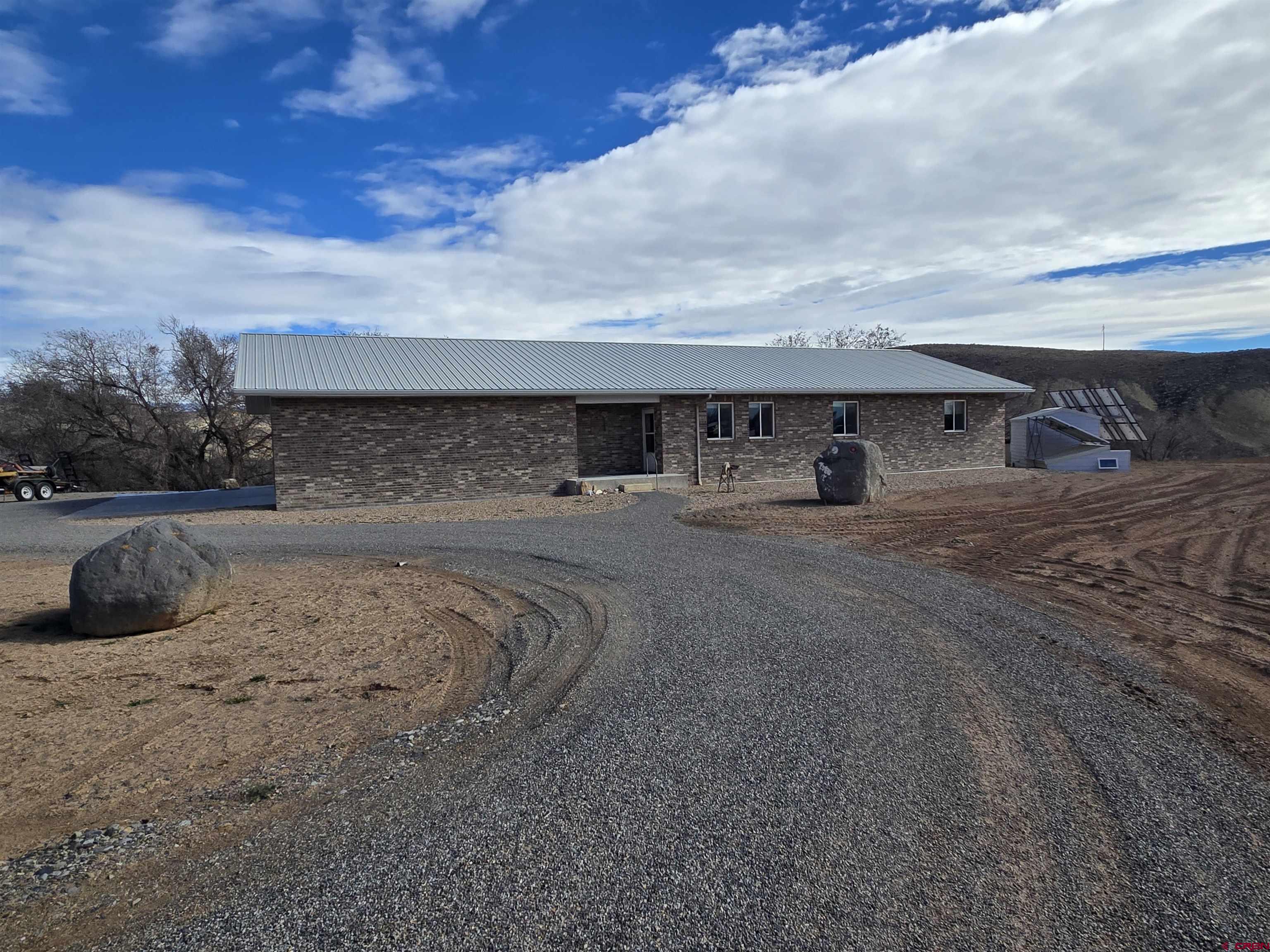 9940 2150th Road Austin, CO 81410 - Photo 1 of 44 a front view of a house with a yard