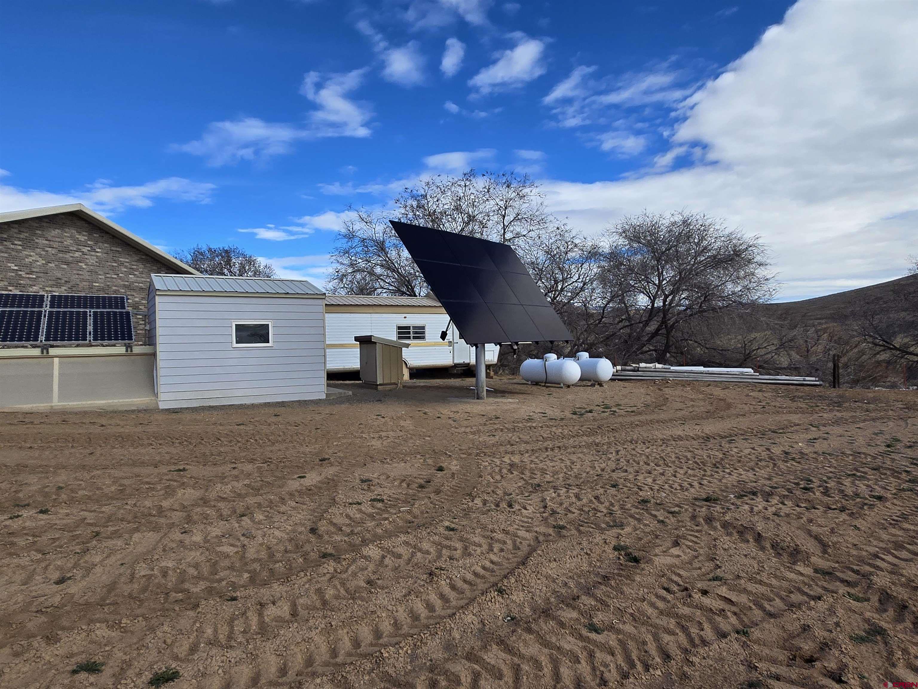 9940 2150th Road Austin, CO 81410 - Photo 21 of 44 a view of a house with a yard