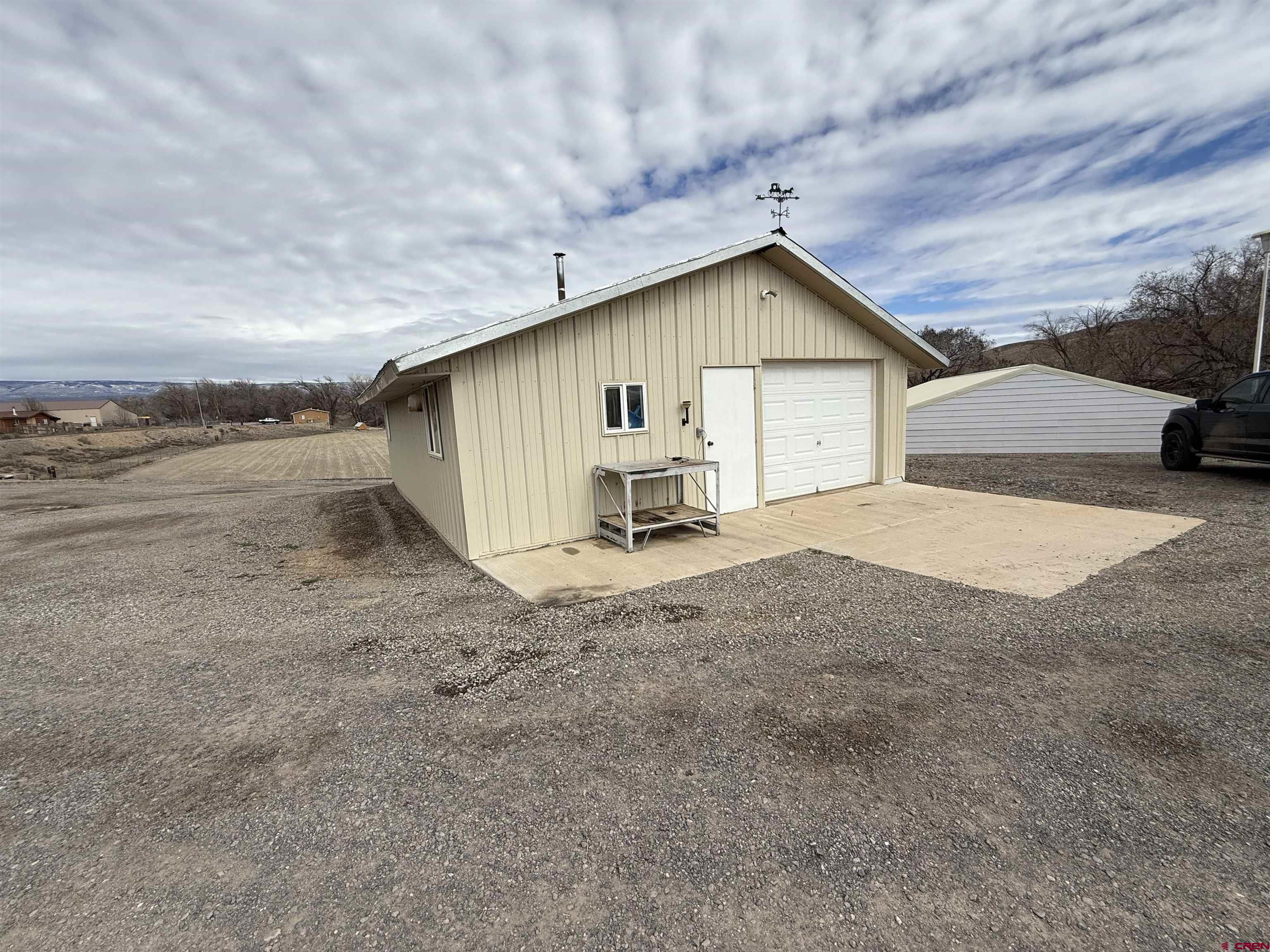 9940 2150th Road Austin, CO 81410 - Photo 25 of 44 a view of a house with backyard and a yard
