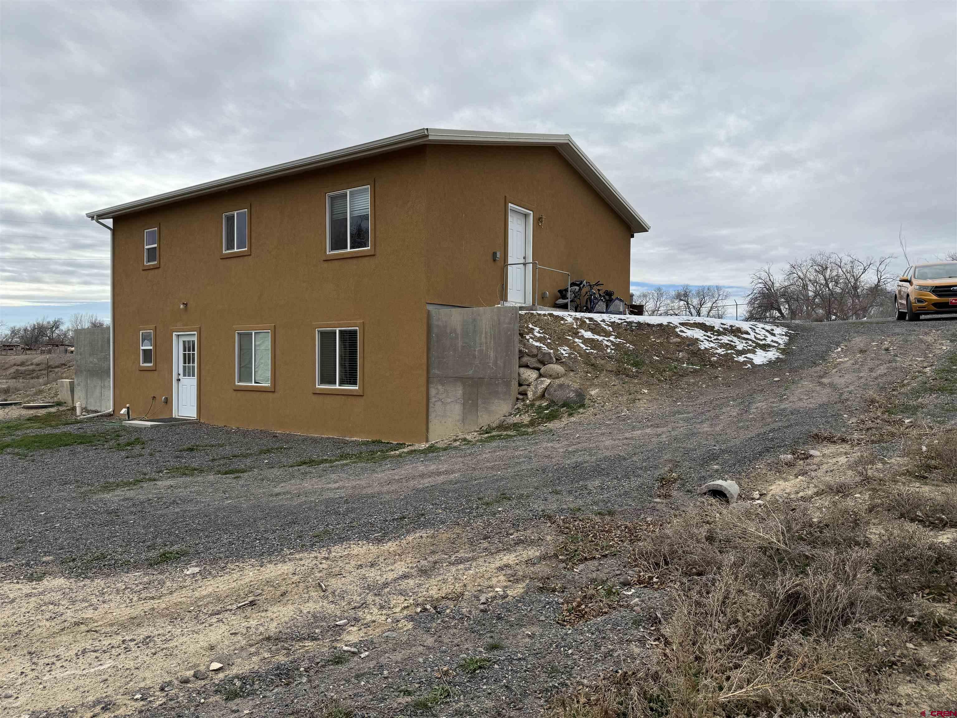 9940 2150th Road Austin, CO 81410 - Photo 36 of 44 a view of a house with a yard