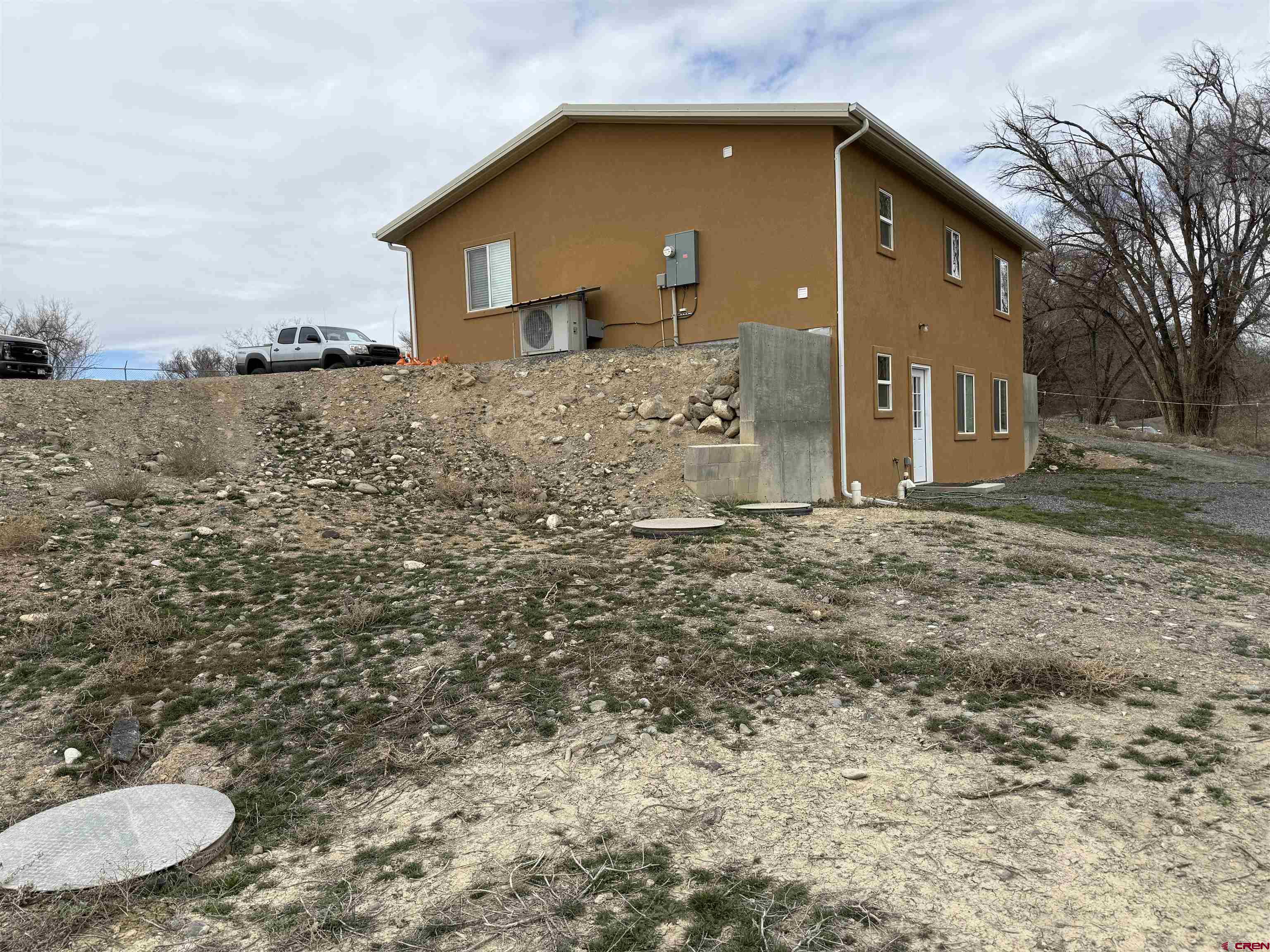9940 2150th Road Austin, CO 81410 - Photo 37 of 44 a front view of a house with a yard