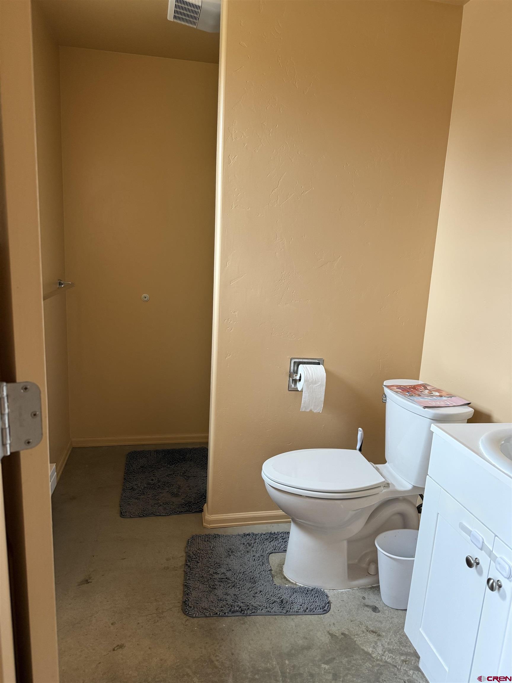 9940 2150th Road Austin, CO 81410 - Photo 40 of 44 a white toilet sitting next to a sink