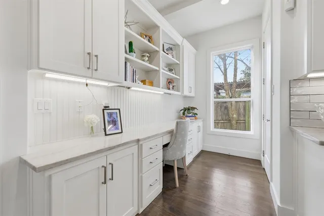 a room with cabinets and window