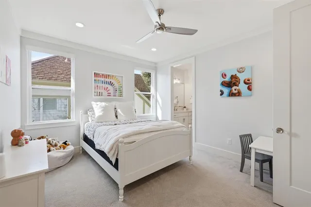 a bed room with a bed and a chair