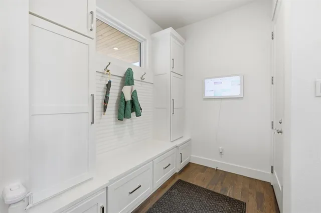 a bathroom with a white tub shower and vanity