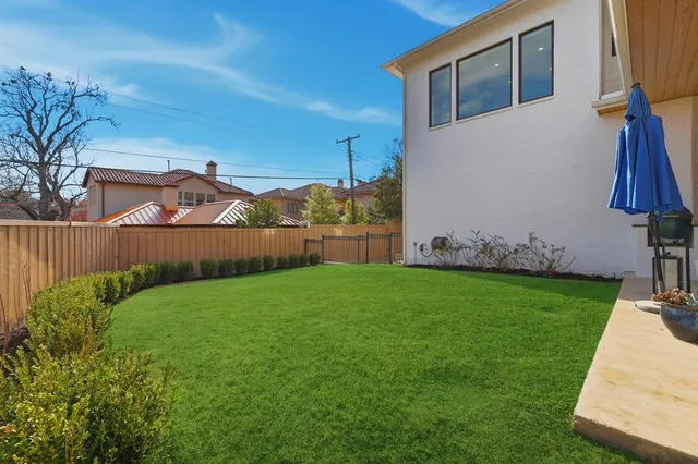 a backyard of a house with lots of green space