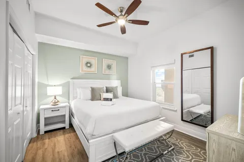a bedroom with a bed and a view of bathroom