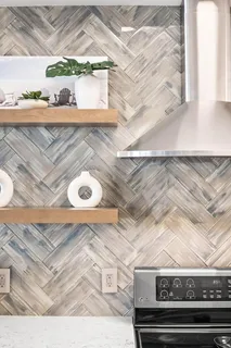a kitchen with stainless steel appliances granite countertop a stove and a refrigerator
