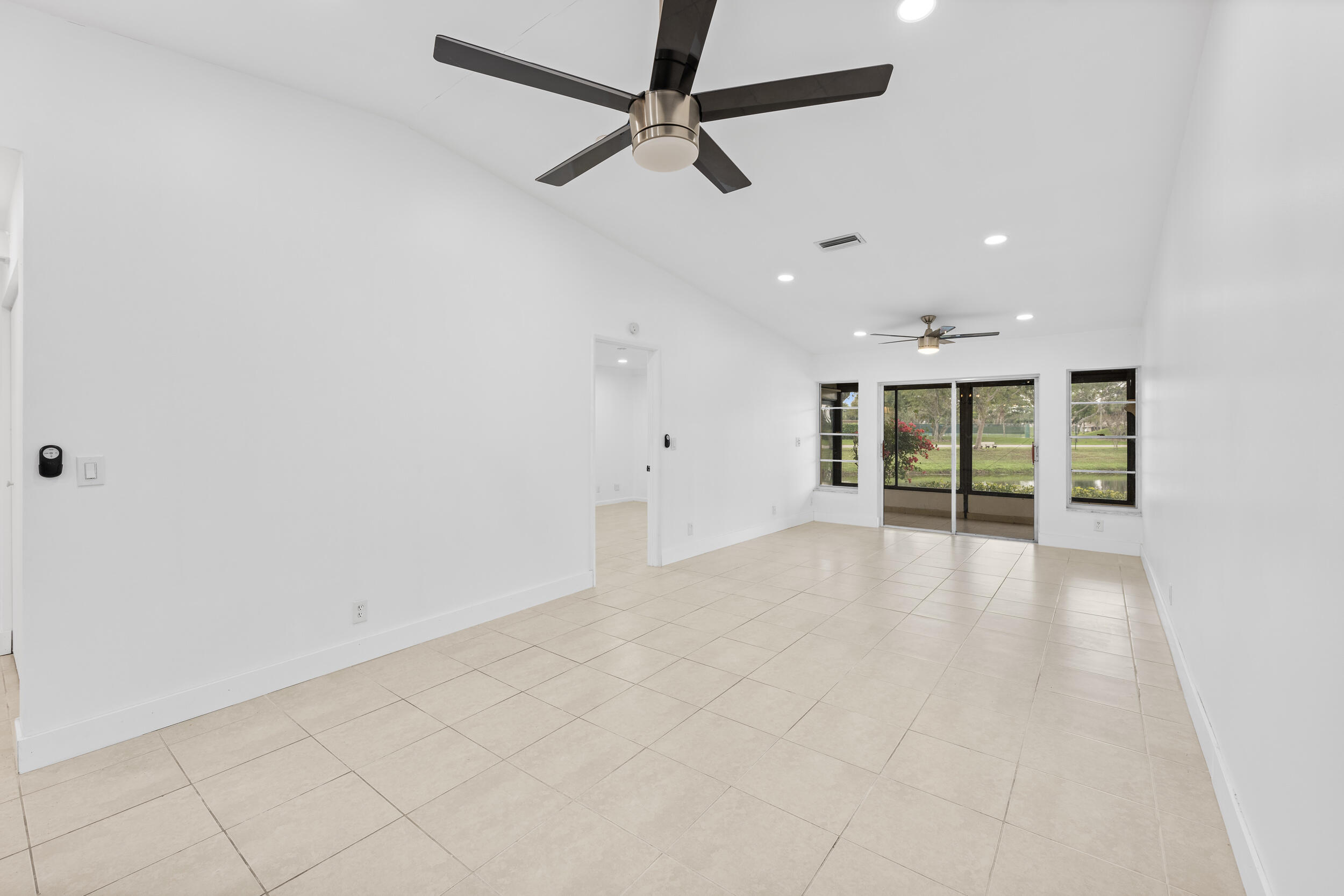 8888 Sunscape Lane Boca Raton, FL 33496 - Photo 11 of 35 a view of an empty room with a window