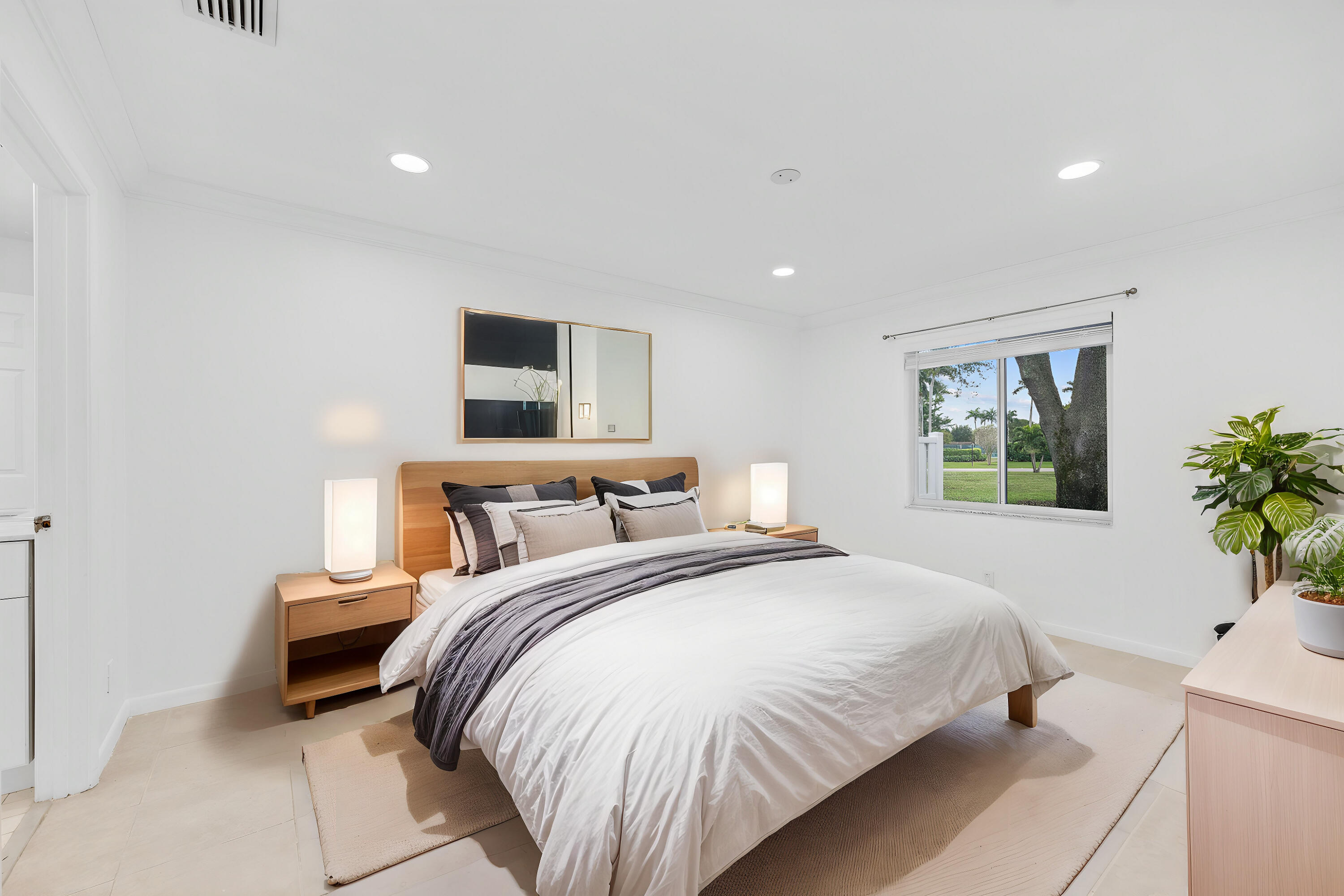 8888 Sunscape Lane Boca Raton, FL 33496 - Photo 17 of 35 a bedroom with a bed and a window