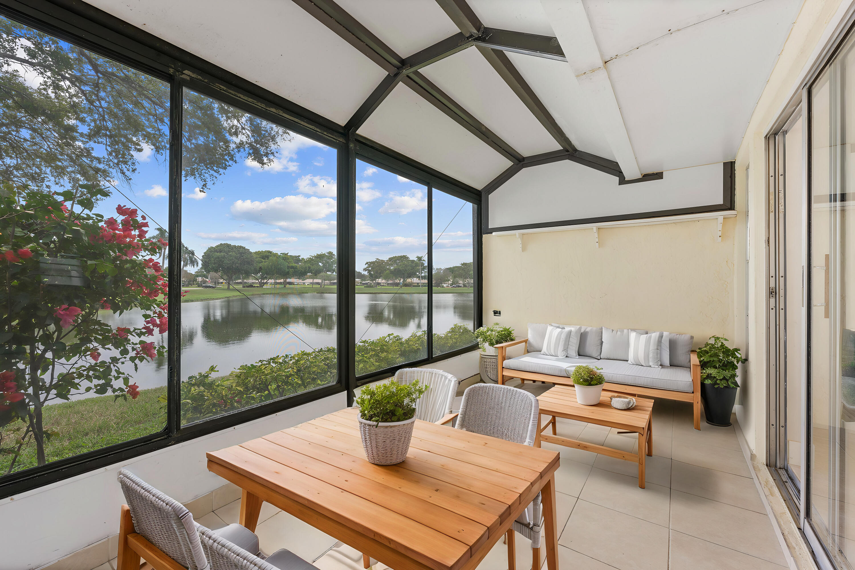 8888 Sunscape Lane Boca Raton, FL 33496 - Photo 23 of 35 a living room with patio furniture and a potted plant
