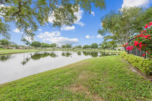 a view of a lake with houses in the back