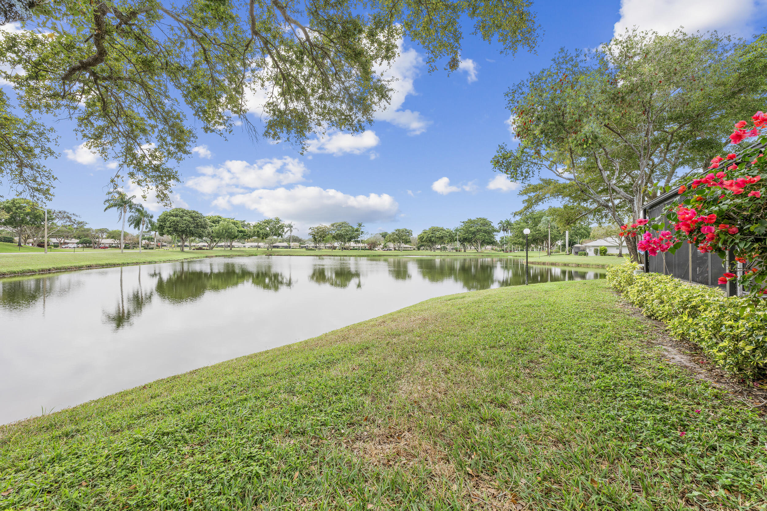 8888 Sunscape Lane Boca Raton, FL 33496 - Photo 28 of 35 a view of a lake with houses in the back