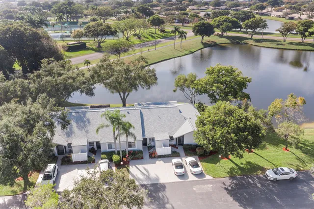 an aerial view of residential house with outdoor space and lake view
